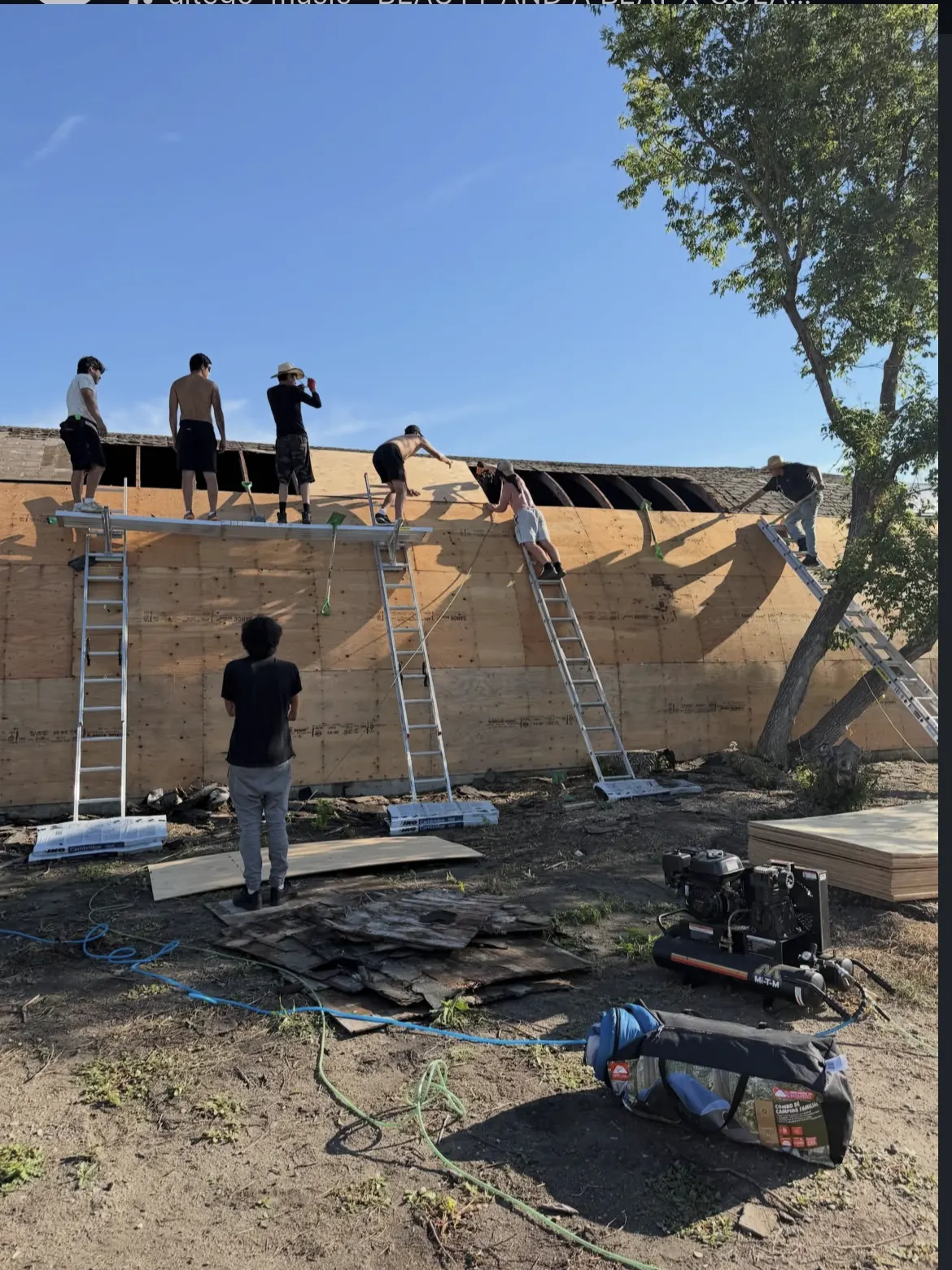 Makan Roofing crew replacing plywood decking on commercial roof near Regina Saskatchewan