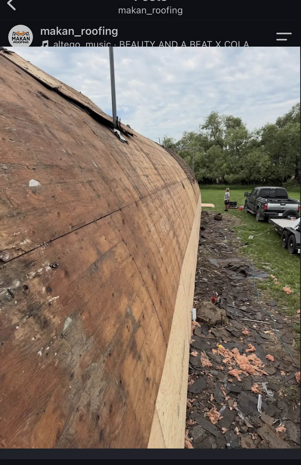 Stripped roof deck on commercial quonset building showing bare plywood and structure, Makan Roofing job near Regina